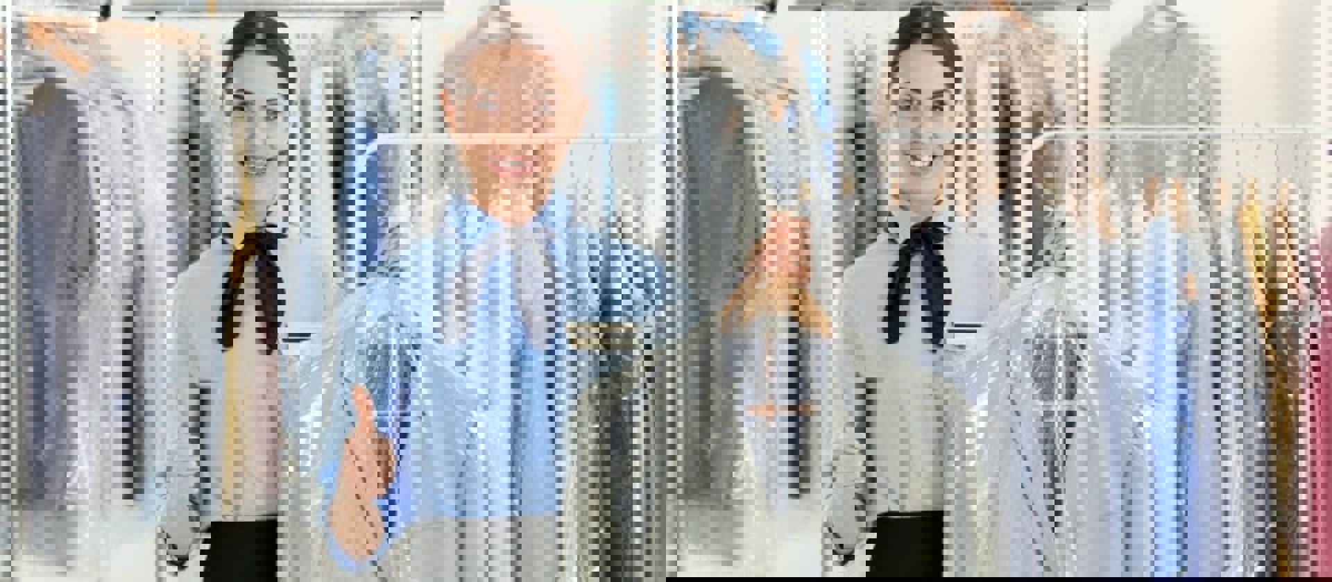 Lady Gesturing Thumbs Up While Holding Dry Cleaning Min